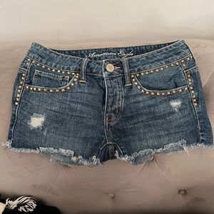 American Eagle gold studded jean shorts